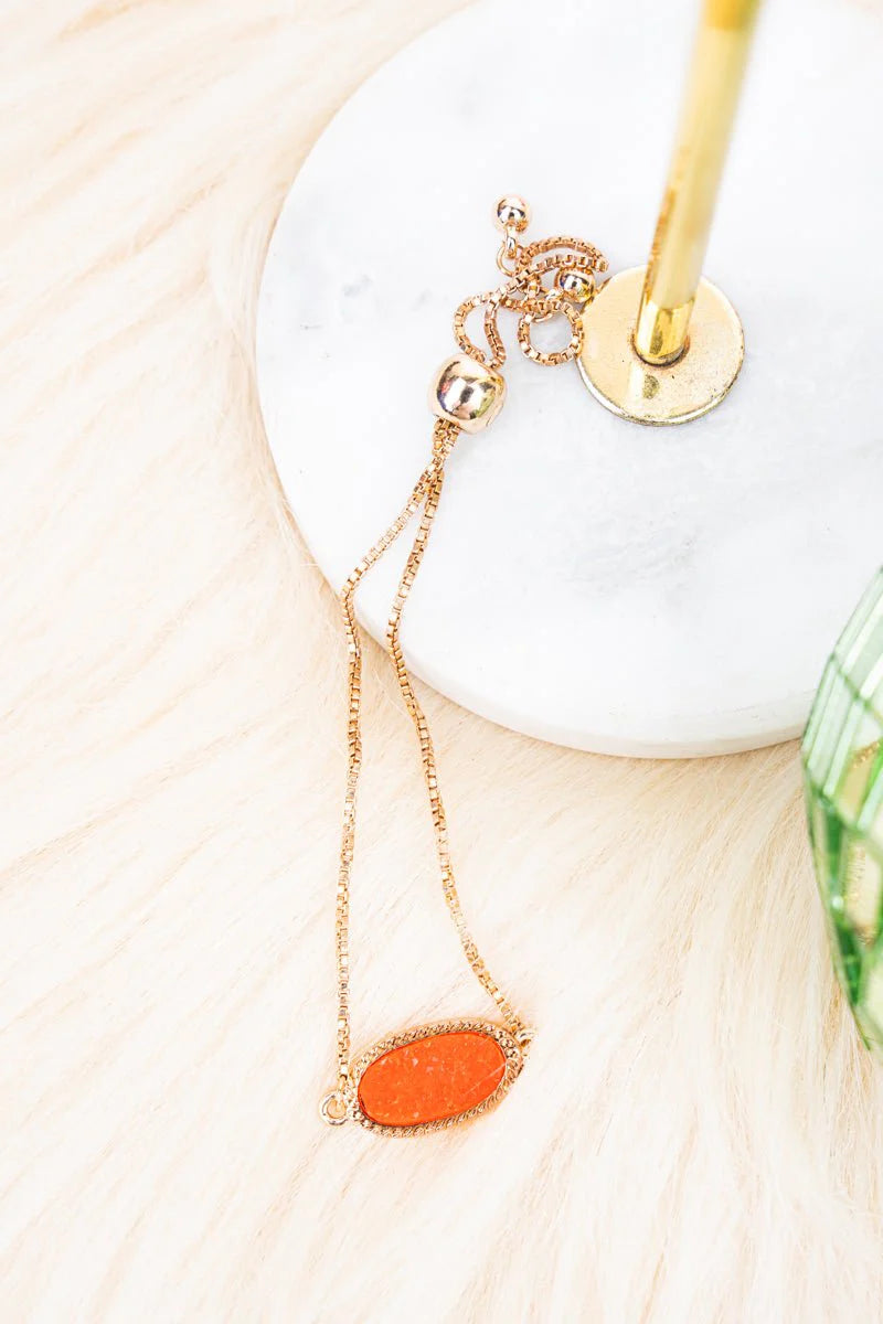 Crystal Avenue Worn Goldtone and Tangerine Druzy Adjustable Bracelet